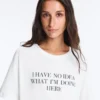 Boxy T-Shirt aus Baumwollmischung mit kurzen Ärmeln und Slogan Boxy T-Shirt aus Baumwollmischung mit kurzen Ärmeln und Slogan
