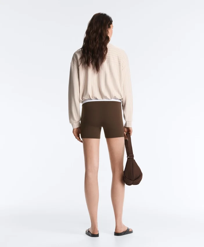 Gestreite Jacke mit ausgestellter Säume Gestreite Jacke mit ausgestellter Säume