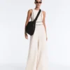 Langer Piqué-Jumpsuit mit Paspelierung aus Baumwolle Langer Piqué-Jumpsuit mit Paspelierung aus Baumwolle
