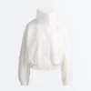 Wasserabweisende Trainingsjacke mit hohem Kragen Wasserabweisende Trainingsjacke mit hohem Kragen