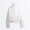 Wasserabweisende Trainingsjacke mit hohem Kragen Wasserabweisende Trainingsjacke mit hohem Kragen